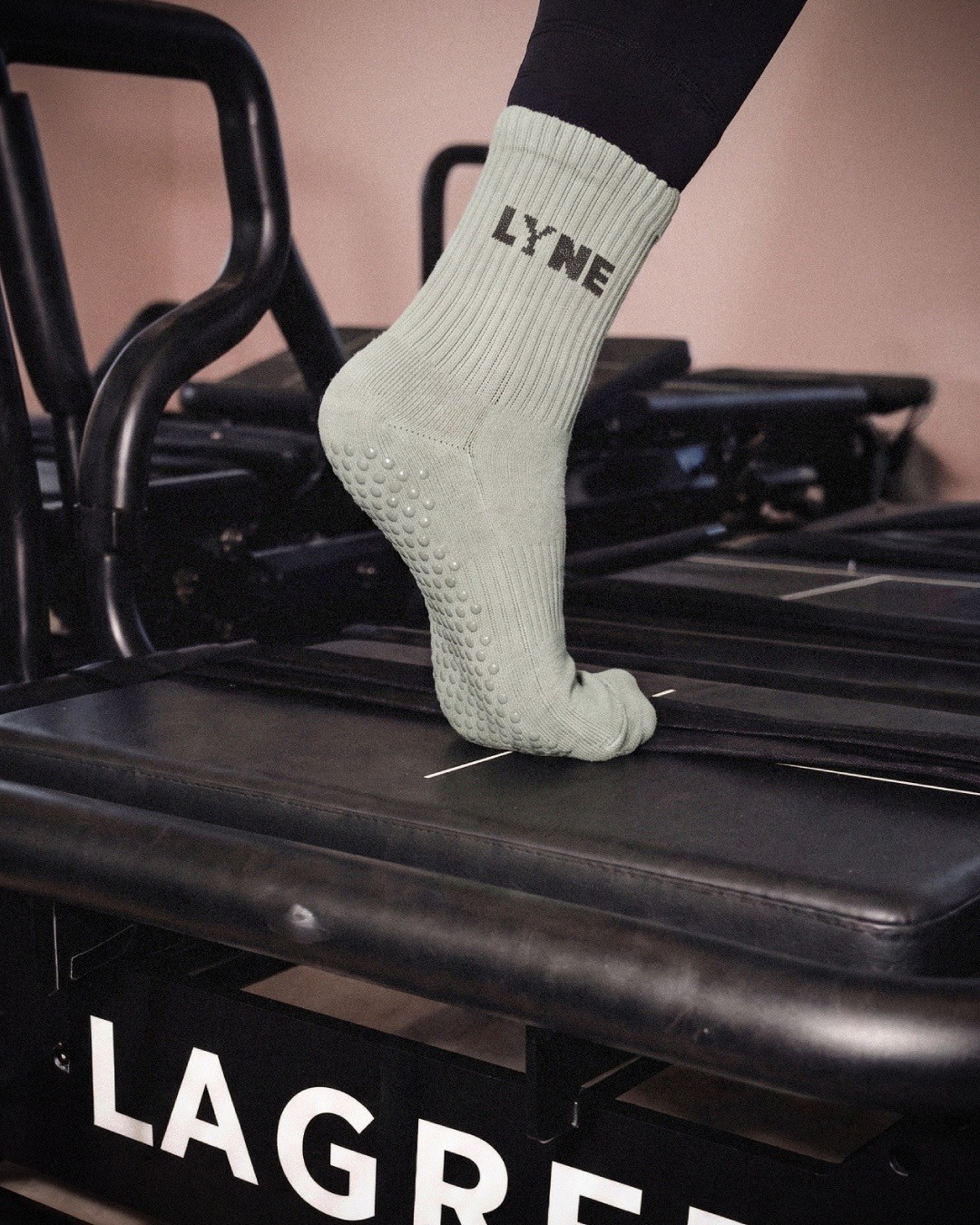 LYNE grip socks on a Megaformer carriage